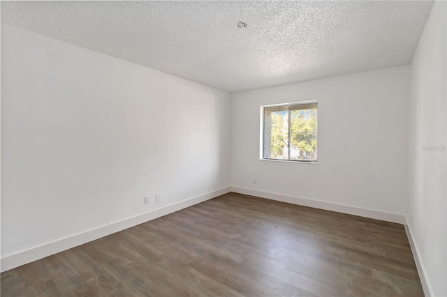 175 Springwood Cir Unit C, Longwood, FL 32750 - spare room with dark wood-style floors and a textured ceiling