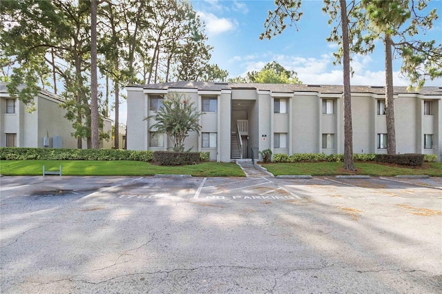 175 Springwood Cir Unit C, Longwood, FL 32750 - view of front facade with uncovered parking and stucco siding