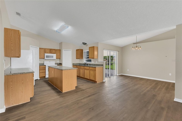 1617 Fairlight St NW, Palm Bay, FL 32907 - kitchen with white appliances, lofted ceiling, a kitchen island, a chandelier, and dark wood-style floors
