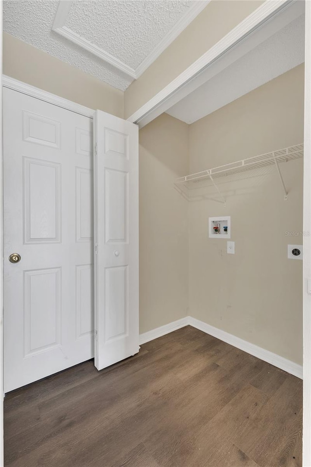 1617 Fairlight St NW, Palm Bay, FL 32907 - washroom featuring washer hookup, dark wood-style flooring, a textured ceiling, electric dryer hookup, and ornamental molding