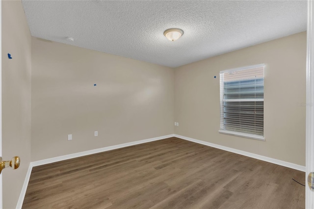 1617 Fairlight St NW, Palm Bay, FL 32907 - unfurnished room featuring wood finished floors and a textured ceiling