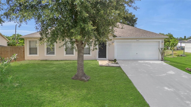1617 Fairlight St NW, Palm Bay, FL 32907 - view of front of house featuring stucco siding, roof with shingles, and a garage