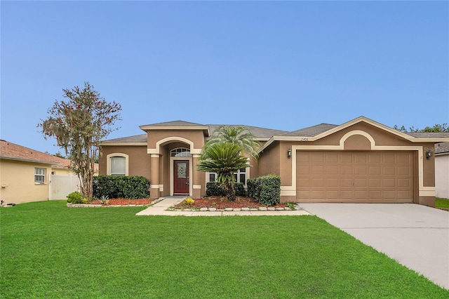 2408 Groveway Dr, Valrico, FL 33596 - mediterranean / spanish-style home featuring stucco siding, driveway, a front lawn, and an attached garage