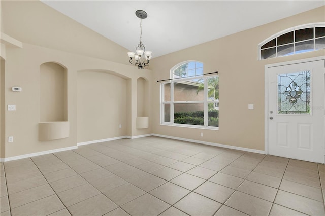 2408 Groveway Dr, Valrico, FL 33596 - entryway with light tile patterned floors, a chandelier, and vaulted ceiling