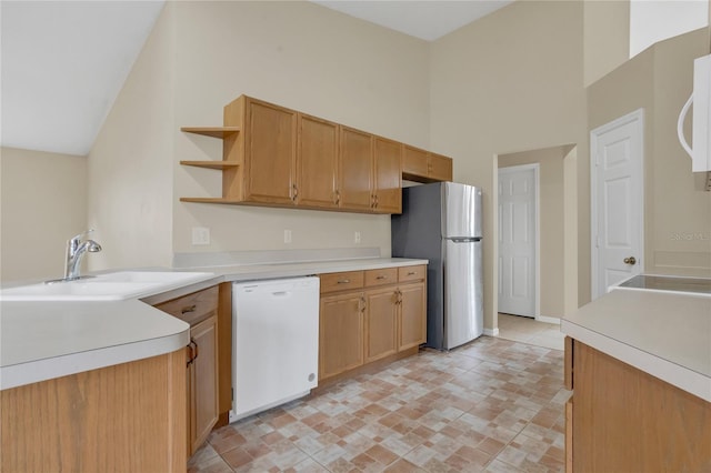 2408 Groveway Dr, Valrico, FL 33596 - kitchen with white dishwasher, freestanding refrigerator, open shelves, high vaulted ceiling, and light countertops