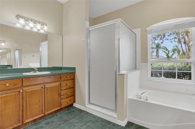 2408 Groveway Dr, Valrico, FL 33596 - bathroom with a shower stall, vanity, a bath, and tile patterned floors