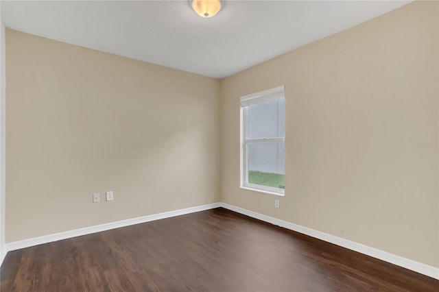 2408 Groveway Dr, Valrico, FL 33596 - spare room featuring dark wood-style floors and baseboards