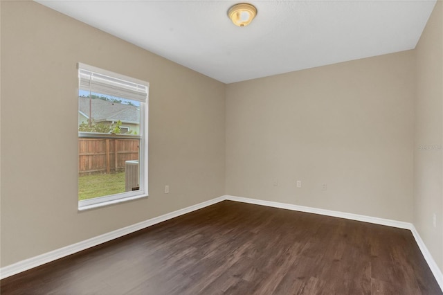 2408 Groveway Dr, Valrico, FL 33596 - spare room with dark wood-type flooring and baseboards