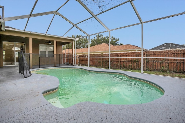 2408 Groveway Dr, Valrico, FL 33596 - view of swimming pool featuring ceiling fan, a patio, a fenced backyard, and glass enclosure