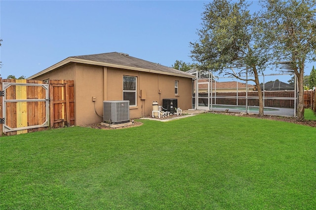 2408 Groveway Dr, Valrico, FL 33596 - rear view of property featuring a fenced backyard, stucco siding, and a lanai