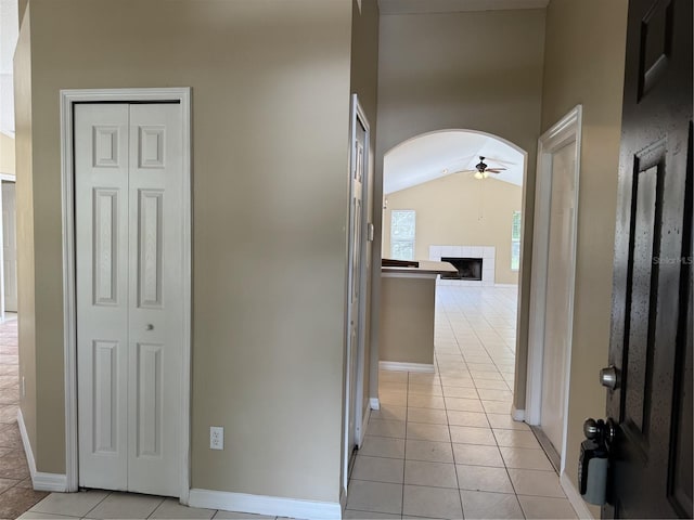 2116 New Victor Rd, Ocoee, FL 34761 - hall with light tile patterned floors, arched walkways, and vaulted ceiling