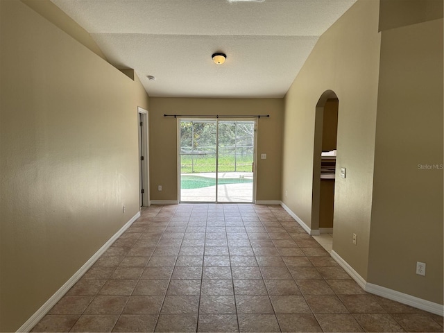 2116 New Victor Rd, Ocoee, FL 34761 - empty room featuring arched walkways and lofted ceiling