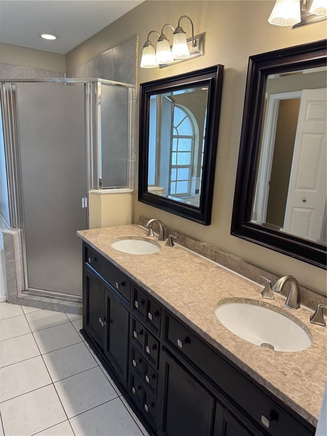2116 New Victor Rd, Ocoee, FL 34761 - bathroom with double vanity, a shower stall, and tile patterned floors