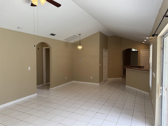 2116 New Victor Rd, Ocoee, FL 34761 - empty room featuring arched walkways, lofted ceiling, ceiling fan, light tile patterned floors, and a smoke detector
