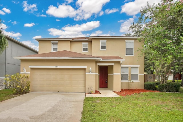 13510 Copper Belly Ct, Riverview, FL 33569 - view of front of home with stucco siding, concrete driveway, a front yard, and an attached garage