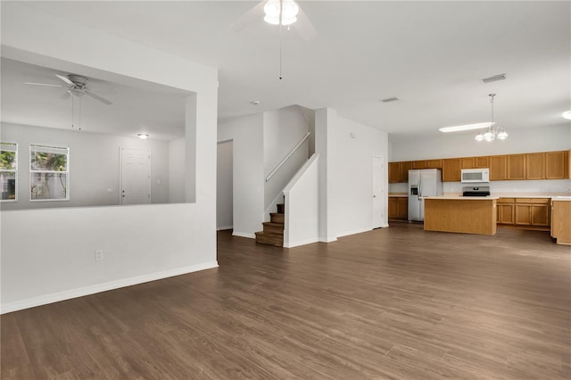 13510 Copper Belly Ct, Riverview, FL 33569 - unfurnished living room featuring a ceiling fan, stairs, and dark wood finished floors