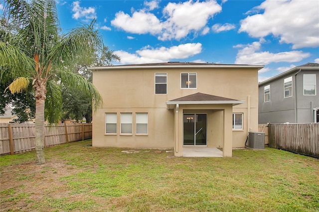 13510 Copper Belly Ct, Riverview, FL 33569 - back of house featuring stucco siding, a fenced backyard, and a patio area