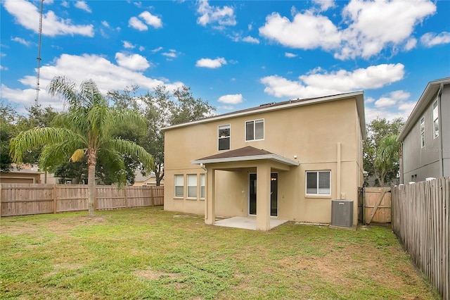 13510 Copper Belly Ct, Riverview, FL 33569 - rear view of house with stucco siding, a patio, and a fenced backyard