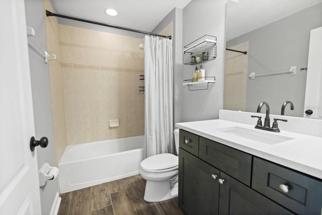 5209 Cape Hatteras Dr, Clermont, FL 34714 - full bathroom featuring vanity, wood finished floors, and shower / tub combo
