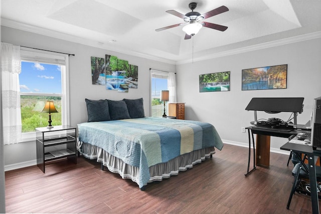 5209 Cape Hatteras Dr, Clermont, FL 34714 - bedroom featuring a tray ceiling, multiple windows, wood finished floors, a ceiling fan, and crown molding