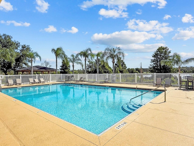 5209 Cape Hatteras Dr, Clermont, FL 34714 - community pool with a patio area