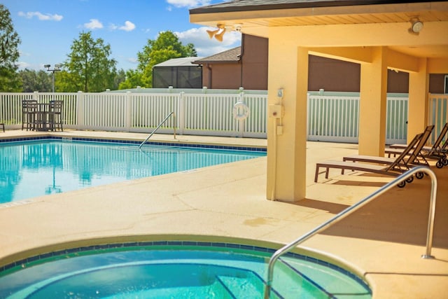 5209 Cape Hatteras Dr, Clermont, FL 34714 - community pool featuring a patio area