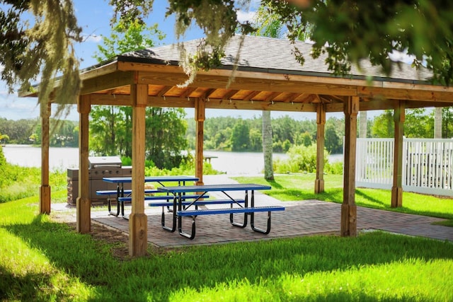 5209 Cape Hatteras Dr, Clermont, FL 34714 - surrounding community with a water view, a yard, and a gazebo