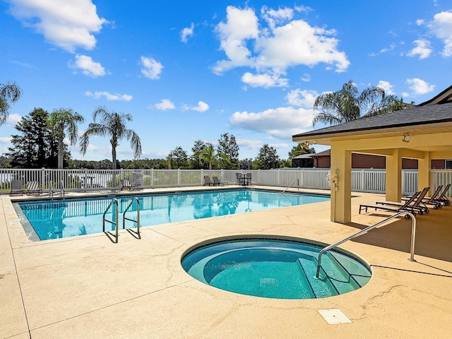 5209 Cape Hatteras Dr, Clermont, FL 34714 - community pool with a patio area and a community hot tub
