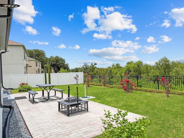 5209 Cape Hatteras Dr, Clermont, FL 34714 - fenced backyard with a patio area and a fire pit