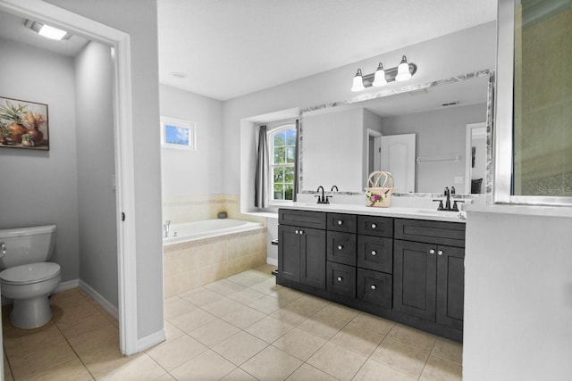 5209 Cape Hatteras Dr, Clermont, FL 34714 - full bath featuring a garden tub, double vanity, and tile patterned floors