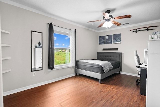 5209 Cape Hatteras Dr, Clermont, FL 34714 - bedroom featuring wood finished floors, ornamental molding, ceiling fan, and a desk