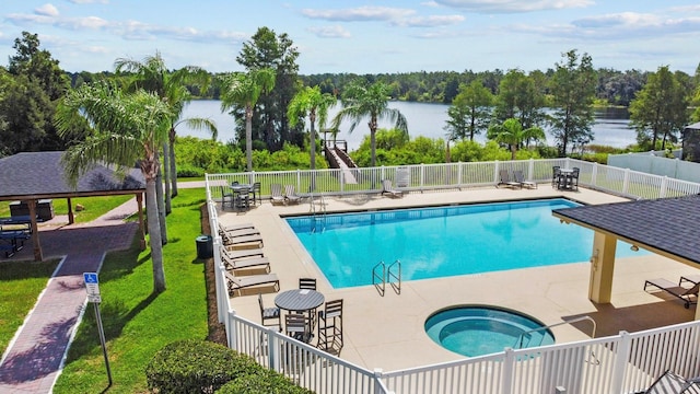5209 Cape Hatteras Dr, Clermont, FL 34714 - community pool with a community hot tub, a water view, and a patio area