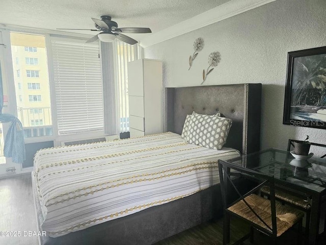 3501 S Atlantic Ave Unit 5020, Daytona Beach, FL 32118 - bedroom with wood finished floors, a textured ceiling, a textured wall, and ceiling fan