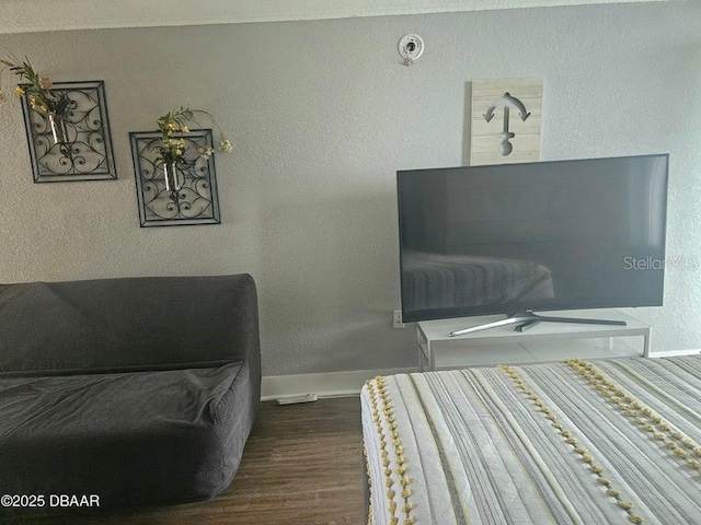 3501 S Atlantic Ave Unit 5020, Daytona Beach, FL 32118 - bedroom with dark wood-style floors and a textured wall