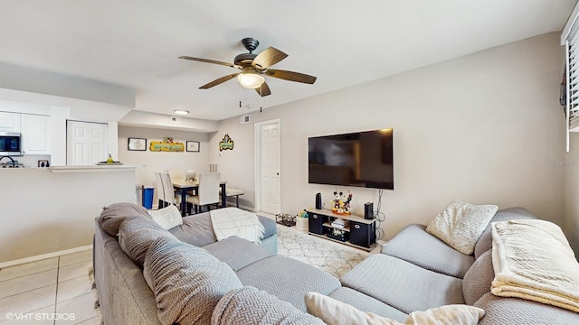 3012 Parkway Blvd Unit 203, Kissimmee, FL 34747 - living area with a ceiling fan and light tile patterned floors