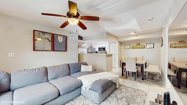 3012 Parkway Blvd Unit 203, Kissimmee, FL 34747 - living area featuring light tile patterned floors and ceiling fan