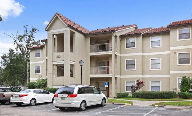 3012 Parkway Blvd Unit 203, Kissimmee, FL 34747 - view of property with uncovered parking