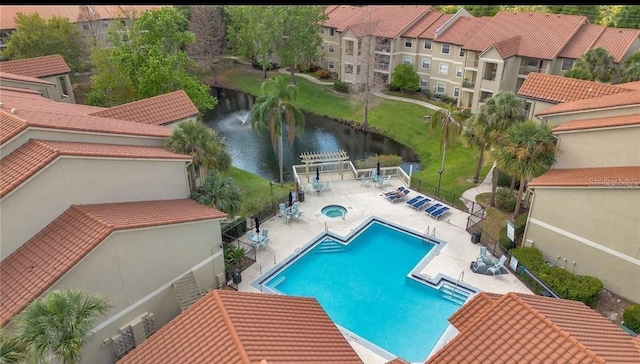 3012 Parkway Blvd Unit 203, Kissimmee, FL 34747 - community pool with a water view, a community hot tub, and a patio area