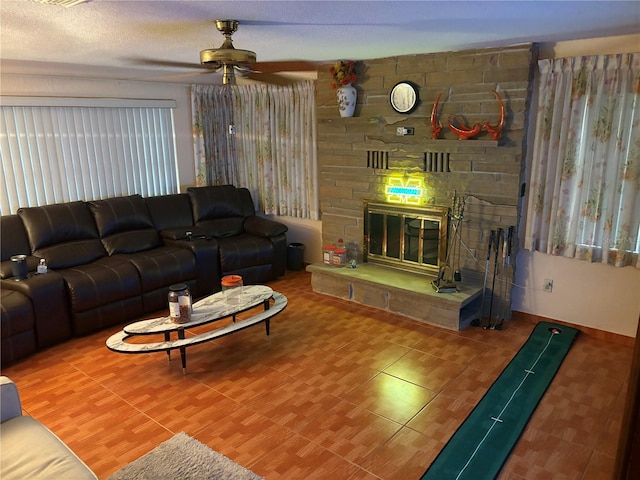 4427 Gilpin Way, Orlando, FL 32812 - living room with ceiling fan and a stone fireplace