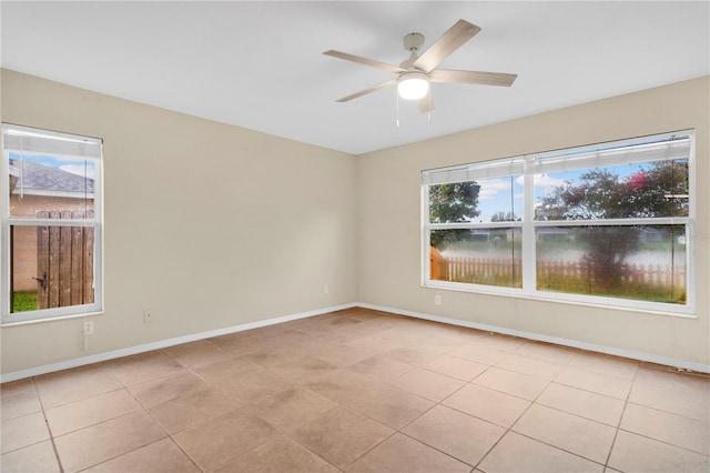 11813 Colyar Ln, Parrish, FL 34219 - unfurnished room featuring ceiling fan and light tile patterned floors