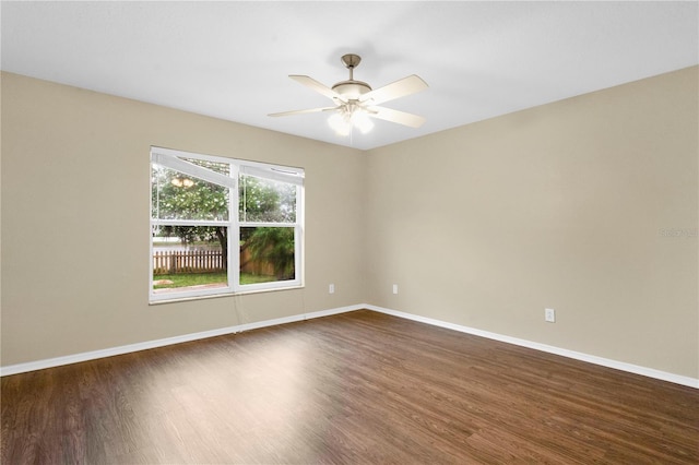 11813 Colyar Ln, Parrish, FL 34219 - unfurnished room featuring dark wood-type flooring and a ceiling fan