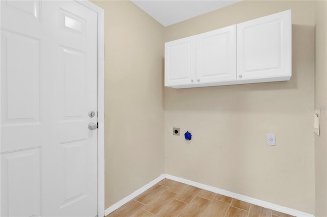 11813 Colyar Ln, Parrish, FL 34219 - washroom featuring electric dryer hookup, wood tiled floors, and cabinet space