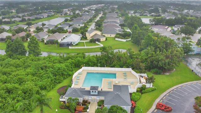11813 Colyar Ln, Parrish, FL 34219 - aerial perspective of suburban area with a pool and a nearby body of water