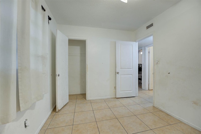 1831 Wilton Ave, Orlando, FL 32805 - unfurnished bedroom with light tile patterned floors and a closet