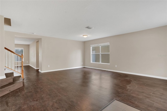 316 Crichton St, Ruskin, FL 33570 - spare room featuring wood finished floors, healthy amount of natural light, and stairs