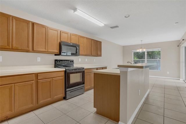 316 Crichton St, Ruskin, FL 33570 - kitchen featuring black appliances, a chandelier, light tile patterned floors, and light countertops