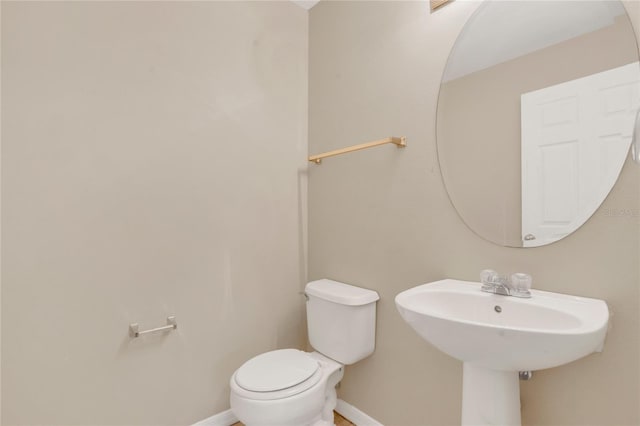316 Crichton St, Ruskin, FL 33570 - half bathroom featuring baseboards and toilet