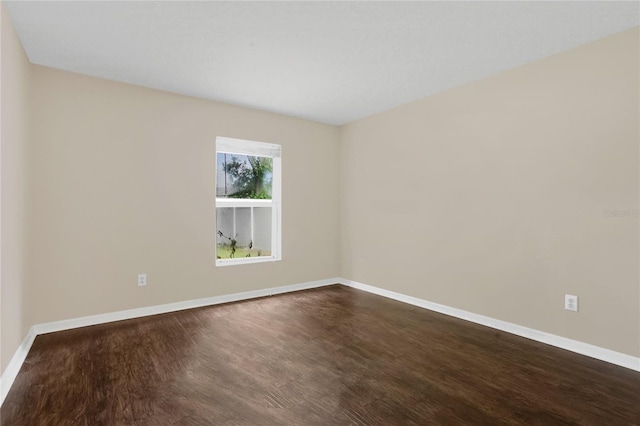316 Crichton St, Ruskin, FL 33570 - unfurnished room featuring baseboards and dark wood-style floors