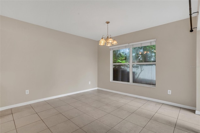 316 Crichton St, Ruskin, FL 33570 - spare room with a chandelier and baseboards