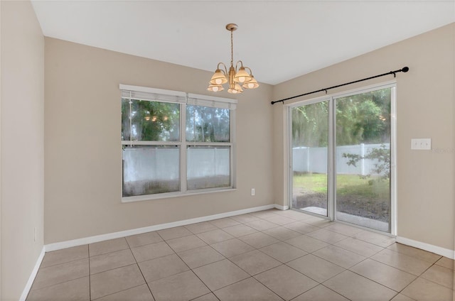 316 Crichton St, Ruskin, FL 33570 - unfurnished room featuring a chandelier and light tile patterned flooring